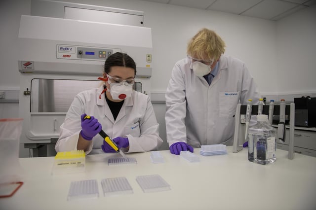 Prime Minister Boris Johnson with quality control technician Kerri Symington on a visit to the Livingston Valneva site in January.