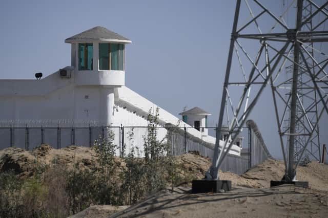 Watchtowers on a high-security facility near what is believed to be a re-education camp where mostly Muslim ethnic minorities are detained, on the outskirts of Hotan, in China's northwestern Xinjiang region in May 2019 (Picture: Greg Baker/AFP via Getty Images)