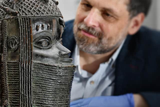 Neil Curtis, head of museums and special collections at Aberdeen University, with the Benin Bronze returned to Nigeria last month. The university's museum became the first in the world to return one of the thousands of artefacts looted by the British military from Benin City in 1897. PIC: