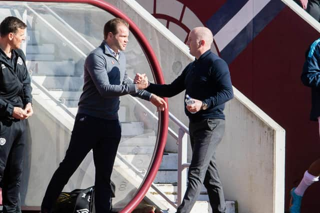 Hearts' and Livingston managers Robbie Neilson (L) and David Martindale (R) shake hands before kick-off during a cinch Premiership match between Heart of Midlothian and Livingston at Tynecastle Stadium, on March 19, 2022, in Edinburgh, Scotland. (Photo by Ross Parker / SNS Group)