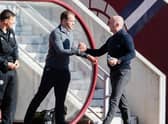 Hearts' and Livingston managers Robbie Neilson (L) and David Martindale (R) shake hands before kick-off during a cinch Premiership match between Heart of Midlothian and Livingston at Tynecastle Stadium, on March 19, 2022, in Edinburgh, Scotland. (Photo by Ross Parker / SNS Group)