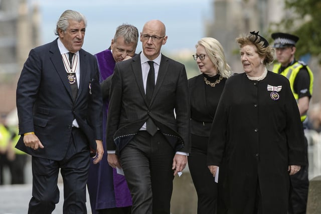 Deputy First Minister John Swinney (centre) arrives at St Giles' Cathedral, Edinburgh for a Service of Prayer and Reflection for Queen Elizabeth II.
