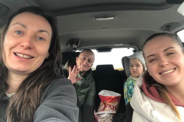 Demelza Sully (left) with some of the Ukrainian refugees she has helped rescue. The 40-year-old from the village of Eredine, in Argyll and Bute,has been driving Ukrainian refugees across Europe to help them escape the conflict. Issue date: Friday March 18, 2022.