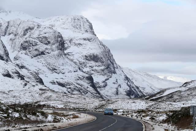 A car travels along the A82 in Glencoe in the Scottish Highlands. Picture: Andrew Milligan/PA Wire