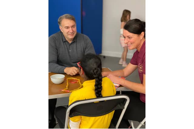 Dmitry Leus meets a young member of Bright Lights youth club
