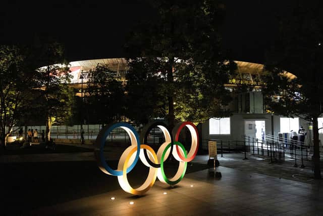 The Olympic rings are seen lit outside the Japan Olympic Museum in Tokyo. Picture: Yuki Iwamura/AFP via Getty Images