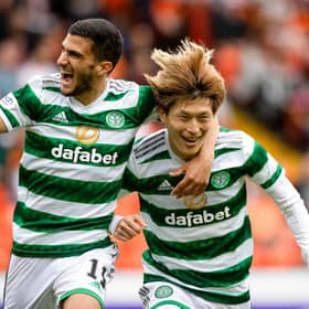 Celtic striker Kyogo Furuhashi celebrates with fellow hat-trick hero Liel Abada after scoring the opener in the 9-0 rout of Dundee United at Tannadice. (Photo by Craig Williamson / SNS Group)