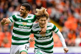 Celtic striker Kyogo Furuhashi celebrates with fellow hat-trick hero Liel Abada after scoring the opener in the 9-0 rout of Dundee United at Tannadice. (Photo by Craig Williamson / SNS Group)