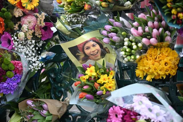 A photograph of Sarah Everard among flowers left in her memory at the bandstand on Clapham Common (Picture: Leon Neal/Getty Images)