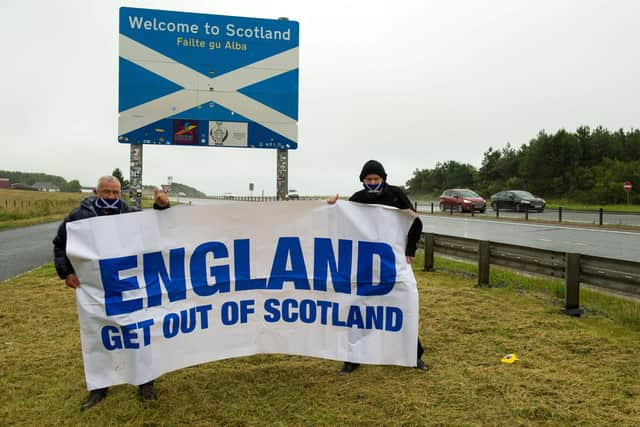 (L-R) James Connelly and Sean Clerkin of Action For Scotland, at the Scottish/English border at Berwick