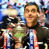 England's Ronnie O'Sullivan poses with the trophy after his victory over England's Judd Trump in the World Championship Snooker final at The Crucible in Sheffield, England on May 2, 2022.