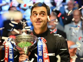England's Ronnie O'Sullivan poses with the trophy after his victory over England's Judd Trump in the World Championship Snooker final at The Crucible in Sheffield, England on May 2, 2022.