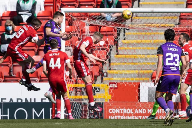 Ryan Edwards rises highest to put United 2-0 up.