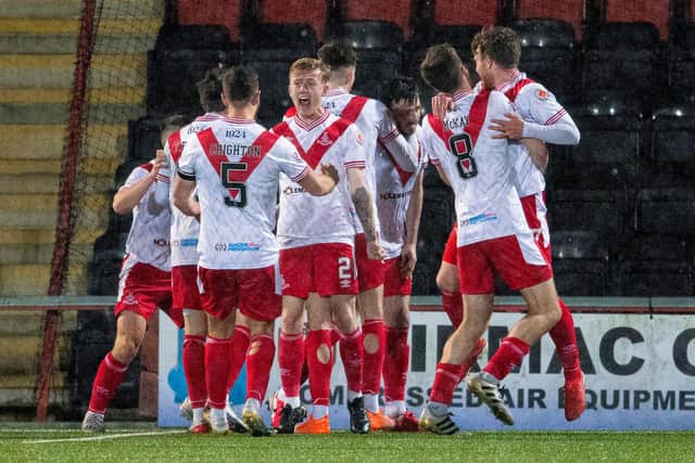 Airdrie's Calum Gallagher (centre) is mobbed by his teammates after scoring the winner against Cove Rangers