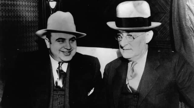 Infamous American gangster Al Capone with US Marshall Laubenheimar (Getty Images)