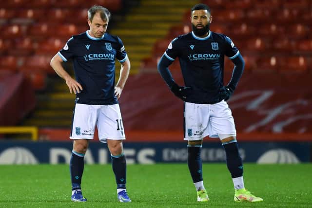 Dundee's Paul McGowan (left) and Alex Jakubiak look dejected during a Cinch Premiership match between Aberdeen and Dundee at Pittodrie Stadium, on December 26, 2021, in Aberdeen, Scotland. (Photo by Ross MacDonald / SNS Group)