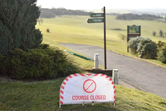 A "COURSE CLOSED" sign is pictured at Dyke Golf Club, north of Brighton (Photo: GLYN KIRK/AFP via Getty Images)