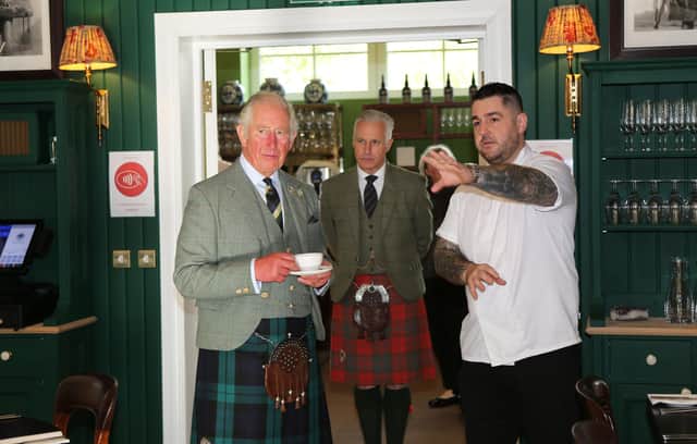 Prince Charles, the Duke of Rothesay, at the Rothesay Rooms restaurant in Ballater with Executive Chef Ross Cochrane. 