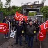 Striking sail staff picket outside Cowlairs maintenance depot and signal centre on June 21, 2022 in Glasgow, Scotland. The biggest rail strikes in 30 years started on Monday night with trains cancelled across the UK for much of the week. The action is being taken by Network Rail employees plus onboard and station staff working for 13 train operators across England (Photo by Jeff J Mitchell/Getty Images).
