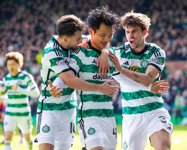 Celtic's Reo Hatate celebrates with Nicolas Kuhn and Matt O'Riley.