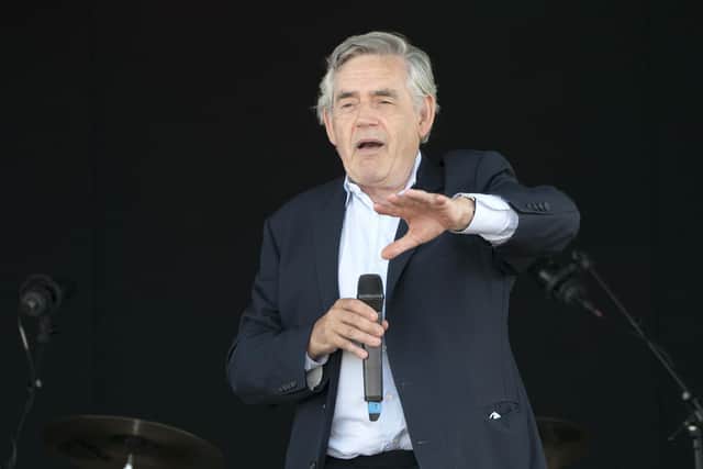 Former Prime Minister Gordon Brown speaks to the crowds and competitors at the Scottish Coal Carrying Championships in Kelty in Fife.  Picture date: Saturday August 28, 2021. PA Photo. The annual event is one of only two Coal Races in the world and the men's race requires participants to carry a 50-kilo bag of coal and the women's race requires a 25-kilo bag of coal to be carried over 1000 metres through the village. Photo credit should read: Jane Barlow/PA Wire 