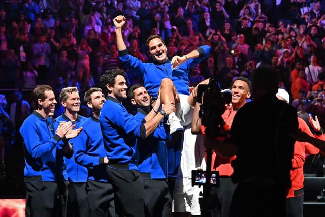 Federer is given the bumps by his Team Europe team-mates after his final match.
