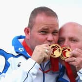Paul Foster (left) and Alex Marshall (right) of Scotland celebrate with their gold medals after the Men's Pairs Final at Kelvingrove Lawn Bowls Centre during day five of the Glasgow 2014 Commonwealth Games.