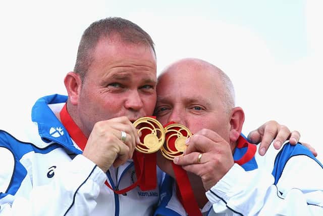 Paul Foster (left) and Alex Marshall (right) of Scotland celebrate with their gold medals after the Men's Pairs Final at Kelvingrove Lawn Bowls Centre during day five of the Glasgow 2014 Commonwealth Games.