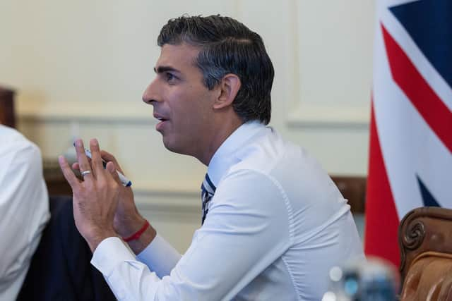 Chancellor Jeremy Hunt (left) seated next to Prime Minister Rishi Sunak