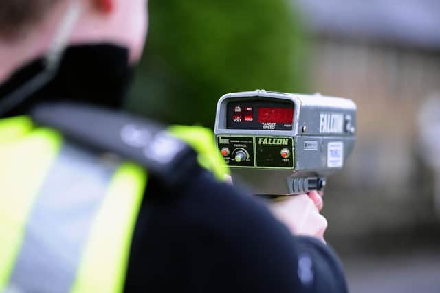 A police officer using a speed gun in Scotland. Picture: Michael Gillen
