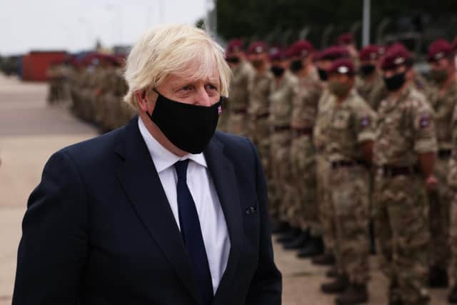 UK Prime Minister Boris Johnson meets with military personnel who worked on the Afghan evacuation during a visit to Melville Barracks. Picture: Dan Kitwood - WPA Pool/Getty Images