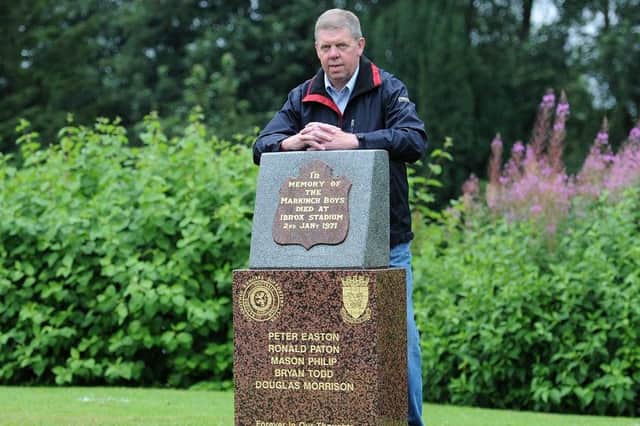 Shane Fenton at the memorial stone for his friends who died at the Ibrox disaster in 1971. (Pic: Fife Photo Agency)