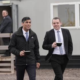Prime Minister Rishi Sunak with Scottish Conservative leader Douglas Ross in the port of Nigg near Inverness.