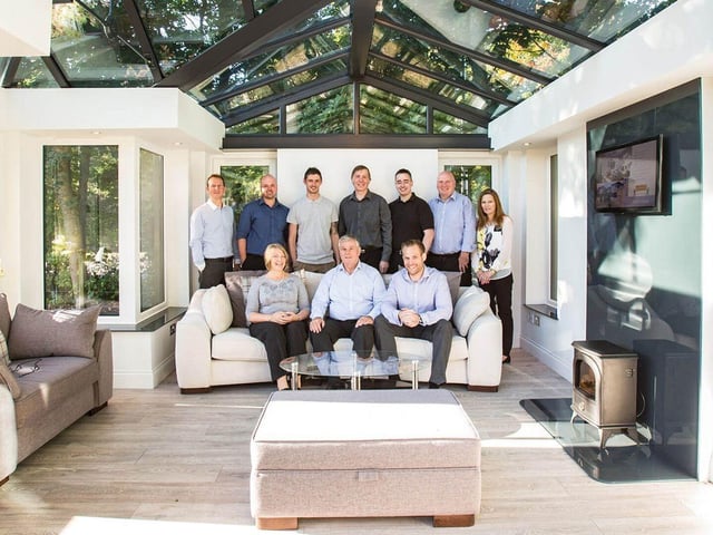 Susan, Peter and Lewis Roden (front) with some of the Mitchell Glass team in 2023.