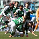 Josh Campbell is mobbed by his team-mates after levelling late on against Rangers.