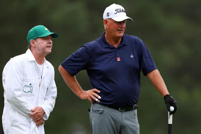 Sandy Lyle of Scotland talks with his caddie on his eventful first hole during the opening round of the 2023 Masters. Picture: Andrew Redington/Getty Images.
