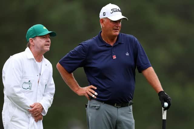 Sandy Lyle of Scotland talks with his caddie on his eventful first hole during the opening  round of the 2023 Masters. Picture: Andrew Redington/Getty Images.