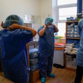 NHS staff prepare to go to work on an intensive care unit in May (Picture: Christopher Furlong/Getty Images)