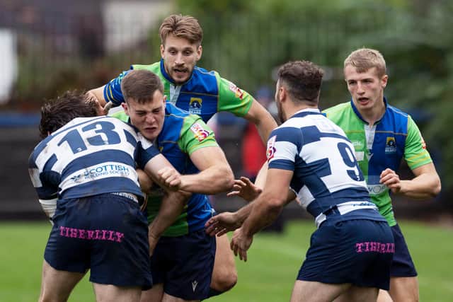 Jordan Edmunds (green) against Rory McMichael and Lloyd Wheeldon during the FOSROC Super6 match between Heriot's and Boroughmuir Bears at Goldenacre (Photo by Ross Brownlee / SNS Group)