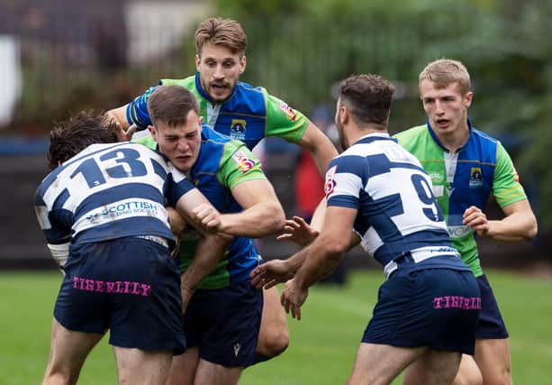 Jordan Edmunds (green) against Rory McMichael and Lloyd Wheeldon during the FOSROC Super6 match between Heriot's and Boroughmuir Bears at Goldenacre (Photo by Ross Brownlee / SNS Group)