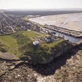 The site of the Burghead Fort. Doorie Hill, where the telegraph pole was placed, sits close to the houses running to the east of the site. PIC: Aberdeen University.