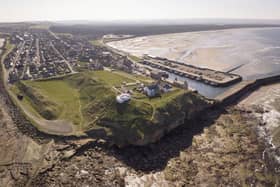 The site of the Burghead Fort. Doorie Hill, where the telegraph pole was placed, sits close to the houses running to the east of the site. PIC: Aberdeen University.