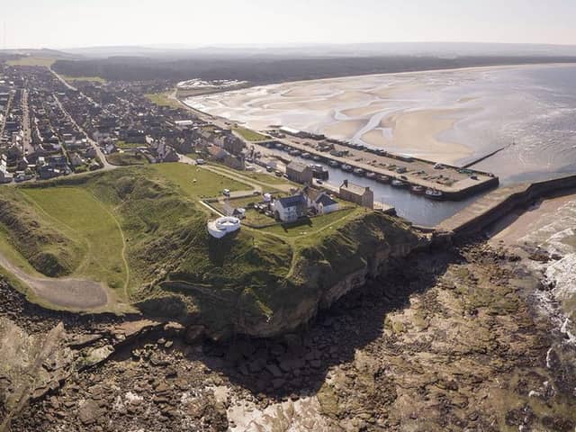 The site of the Burghead Fort. Doorie Hill, where the telegraph pole was placed, sits close to the houses running to the east of the site. PIC: Aberdeen University.