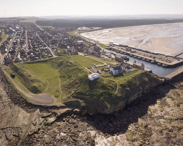 The site of the Burghead Fort. Doorie Hill, where the telegraph pole was placed, sits close to the houses running to the east of the site. PIC: Aberdeen University.