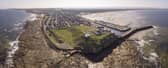 The site of the Burghead Fort. Doorie Hill, where the telegraph pole was placed, sits close to the houses running to the east of the site. PIC: Aberdeen University.