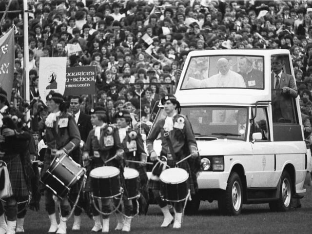 Pope John Paul II enters Edinburgh's Murrayfield rugby stadium in the 'Popemobile'. Around 40.000 young people from all over Scotland came for the Scottish National Youth Pilgrimage, singing 'You'll Never Walk Alone' and chanting 'John Paul, John Paul'.