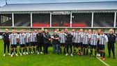 ​Fraserburgh FC chairman, Finlay Noble, hands over the cheque to Broch RNLI coxswain, Vic Sutherland.