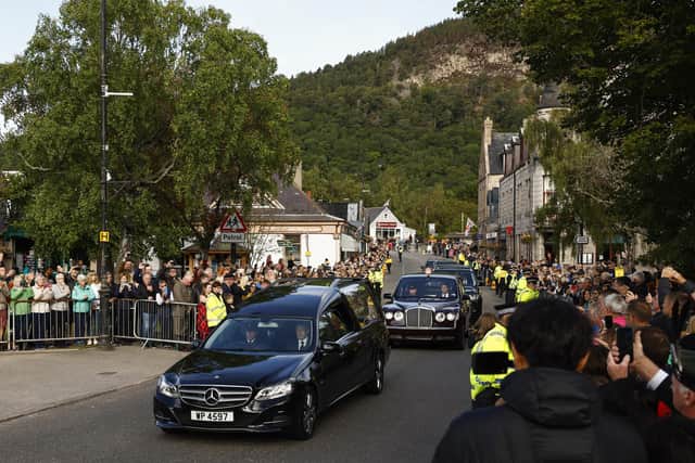 People gather in tribute in Ballater as the cortege carrying the coffin of the late Queen Elizabeth II passes by on September 11, 2022. PIC:  (Photo by Jeff J Mitchell/Getty Images)