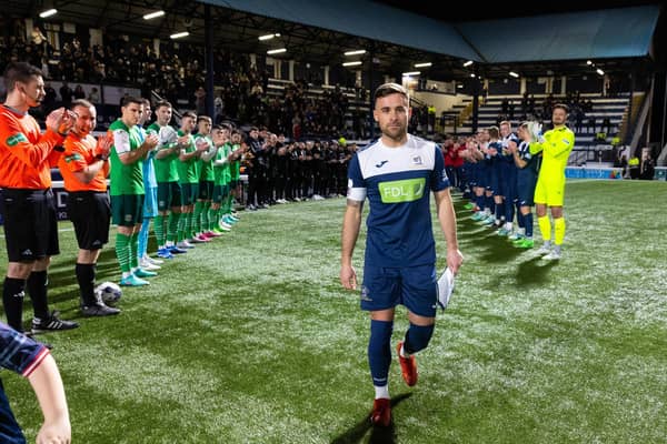 Raith's Lewis Vaughan walks out to a guard of honour ahead of his own testimonial match against Hibs at Stark's Park.  (Photo by Ross Parker / SNS Group)