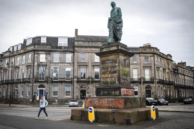 Graffiti is daubed on a statue in Edinburgh in memorial of Robert Dundas, 2nd Viscount Melville, the son of Henry Dundas. Picture: Jane Barlow/PA Wire
